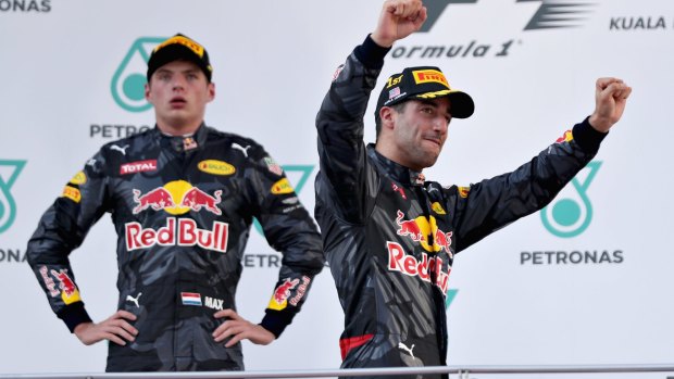 Daniel Ricciardo celebrates his win in the Malaysia Grand Prix in October, Max Verstappen looks on. 