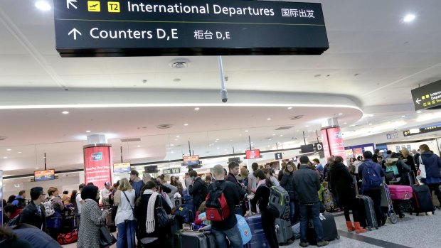 Passengers wait in long queues after Australian Border Force staff hold a two-hour strike at Melbourne Airport.