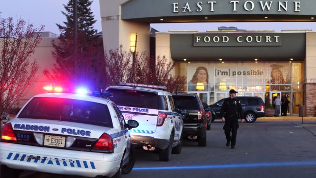 Police officers at the East Towne Mall in Madison, Wisconsin, after a gun battle between Christmas shoppers.