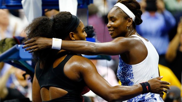 Serena Williams hugs her sister Venus after defeating her during their US Open quarter-final.