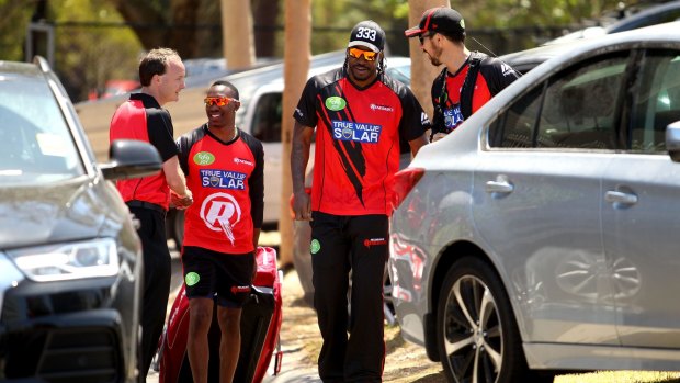 Melbourne Renegades international signing Chris Gayle (second from right) poses for a photo at Junction Oval on Tuesday.