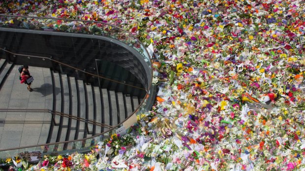 A sea of flowers at Martin Place formed a makeshift memorial in the days after the siege.
