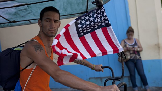 A bicycle taxi is adorned with the American flag in the Old Havana area of Havana, earlier this month. As diplomatic relations between the US and Cuba thaw, an unexpected outburst of American flag waving in Cuba has followed. 