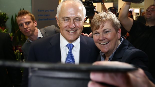 Prime Minister Malcolm Turnbull takes a selfie during the shopping centre visit.