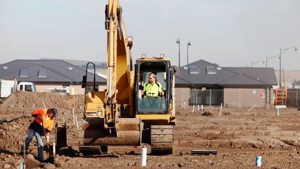 Workers build Stockland's Highlands residential development in Craigieburn.