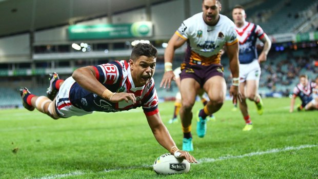 Flying Rooster: Latrell Mitchell dives over the line for a try.