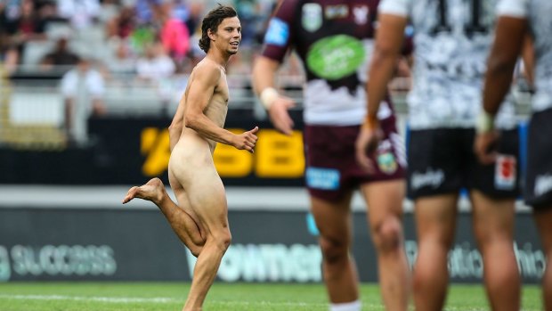 A streaker runs onto the field during the Auckland Nines match between the Warriors and the Sea Eagles.