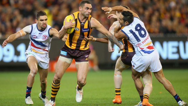 Eddie Betts attempts, in vain, to stop Shaun Burgoyne during the semi-final on Friday.