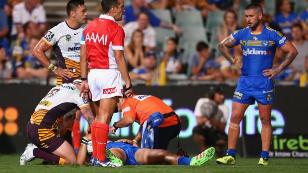 Out of the game: Corey Norman receives attention after injuring his neck against the Broncos. 
