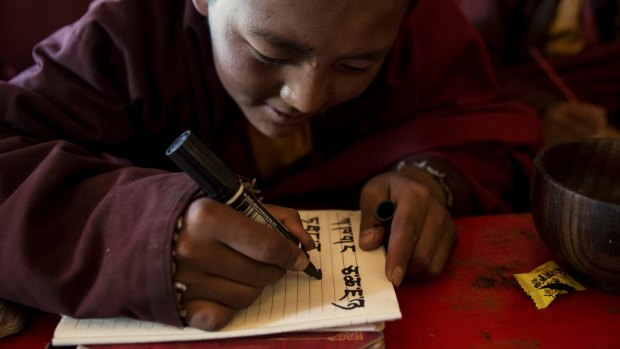 Young monks practice writing Tibetan at a monastery in Yushu, China, earlier this year.