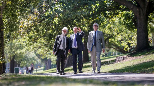 Environment Minister Josh Frydenberg (centre) with Barry Jones (left) and Tom Harley (right) on St Kilda Road on Friday.