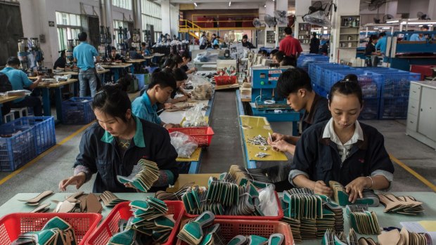 Workers on the assembly line at the Huajian shoe factory in Dongguan, China, where shoes for Ivanka Trump's company have been produced.