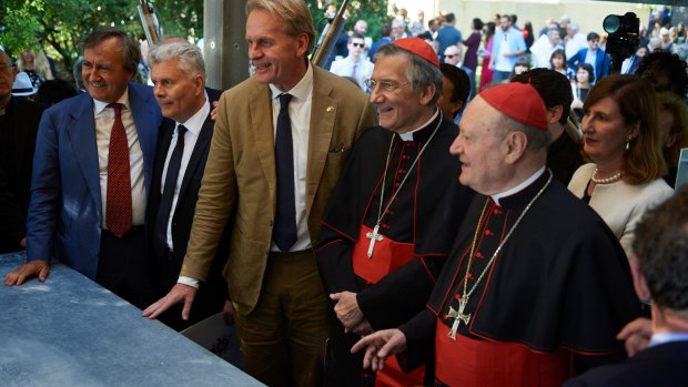 Sean Godsell (centre) with Vatican officials at the opening of his contribution to the Venice Architecture Biennale. 