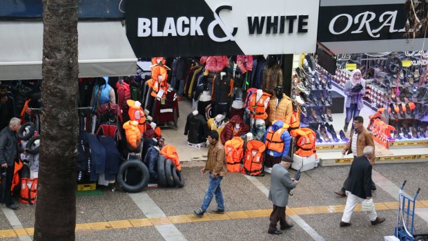 The busy commercial strip in Izmir, Turkey, where life vests and buoys are top selling items.