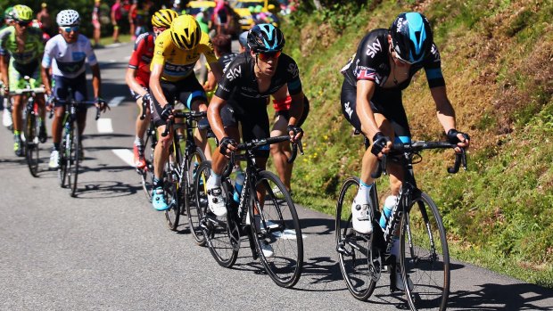 Brilliant team effort ... Tour leader Chris Froome rides behind his Team Sky teammates, Australian Richie Porte and Geraint Thomas of Great Britain, during the tenth stage.