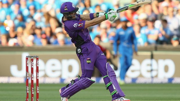 Hobart Hurricanes captain Tim Paine hits a six during the match against the Strikers.