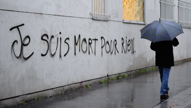 Graffiti reading "I died for nothing" on a wall in Paris this week. 