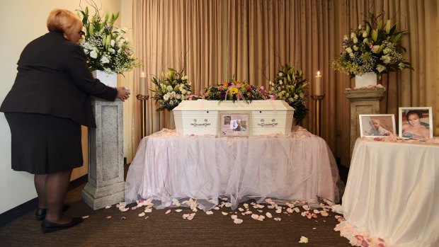 Carmel Costanzo of Peter Elberg Funerals makes final preparations near the coffin containing the remains of Khandalyce Pearce at Peter Elberg Funerals. 