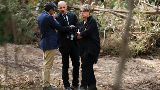 Detective Chief Inspector Gary Jubelin, centre, with Deputy Coroner Elaine Truscott  at the search site in the Royal National Park.