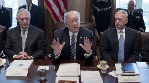 Donald Trump between James Mattis, US Secretary of Defence, right, and Rex Tillerson, US Secretary of State, on Monday. 