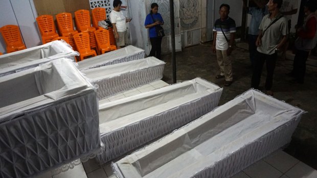 The coffins in the Cilacap police station on Sunday.