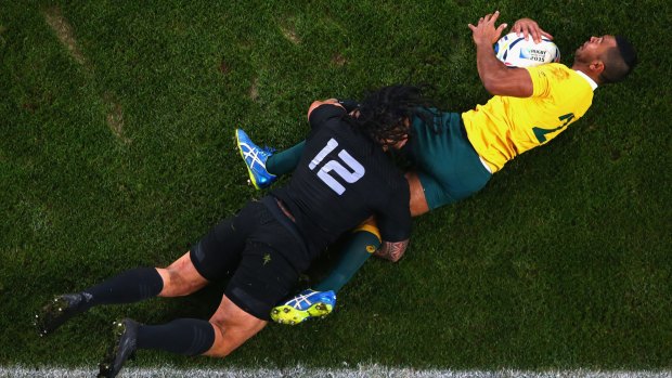 Kurtley Beale is tackled by Ma'a Nonu.
