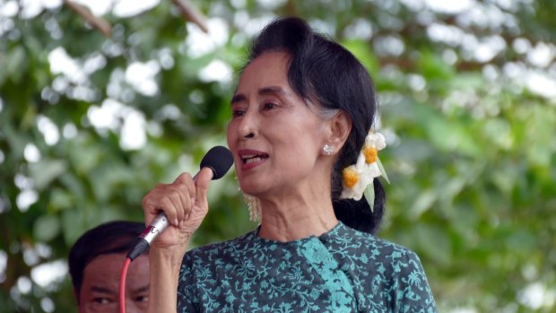 Myanmar opposition leader Aung San Suu Kyi this week; a young Myanmar woman has been arrested for a Facebook posting referring to the colour of Suu Kyi's garment, and suggesting that if people love her so much they wear a piece of her longyi, sarong, on their heads. This idea is considered offensive by some in Myanmar. 