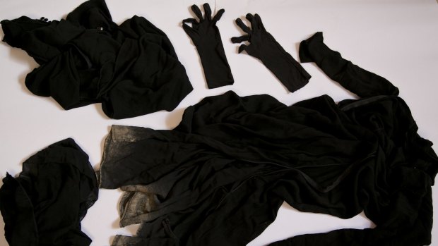 Clothing worn by a Yazidi girl enslaved by Islamic State militants collected to document Islamic State group crimes.