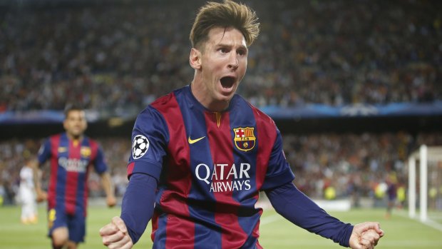 Star of the show: Barcelona's Lionel Messi celebrates scoring their first goal.