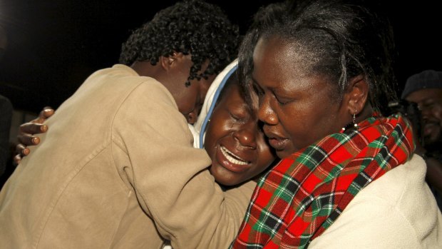 People react after meeting a relative who was rescued after the Garissa University attack.