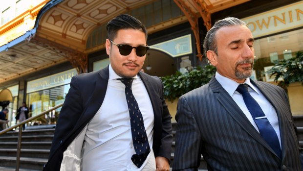 My Kitchen Rules contestant David Vu, left, leaves the Downing Centre Court with his lawyer Robert Daoud in Sydney on Friday.
