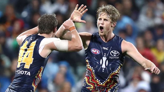 Rory Sloane celebrates a goal against the Dockers.