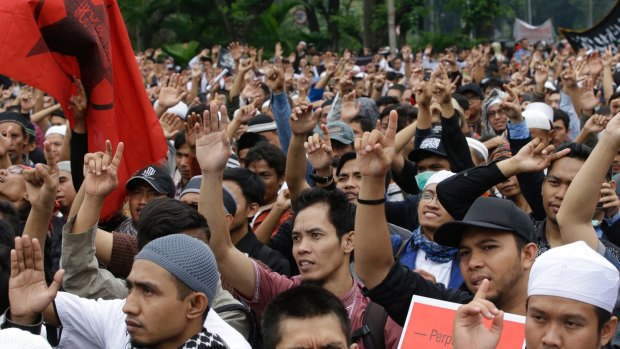 Indonesian Muslims shout "Allahu Akbar' (God is great) during a rally to denounce the decree in Jakarta on Tuesday. 