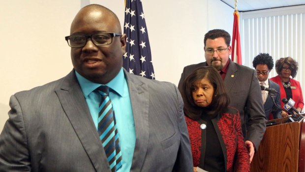 Elected Fergsuon officials leave a press conference on Wednesday. Fom left: city manager DeCarlon Seewood, councilwoman Laverne Mitchom, mayor James Knowles, councilman Wesley Bell and councilwoman Ella Jones.