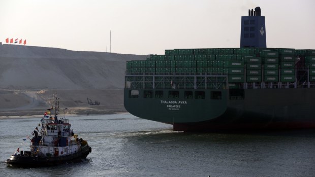 A ship passing during the opening ceremony of the new Suez Canal expansion on Thursday. 