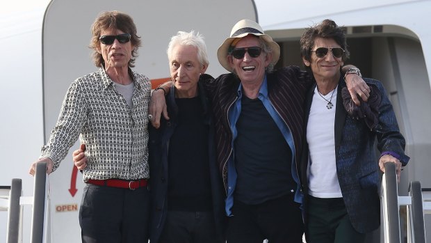 Back in the studio ... Mick Jagger, Charlie Watts, Keith Richards and Ronnie Wood of the Rolling Stones exit their plane after landing at the Jose Marti International Airport on March 24 in Havana, Cuba.