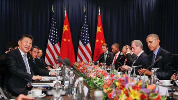 Chinese President Xi Jinping, left, speaks during a meeting with  Barack Obama in Lima.