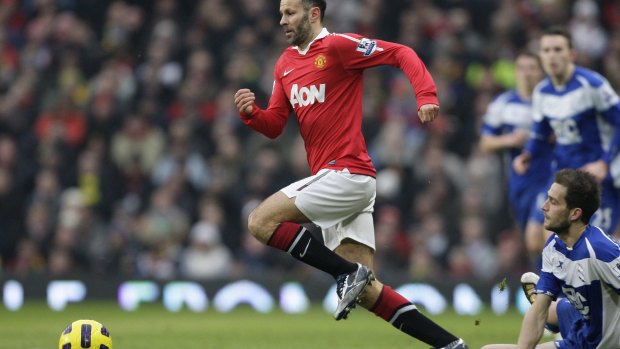 Ryan Giggs races past  Birmingham players at Old Trafford in July, 2016.