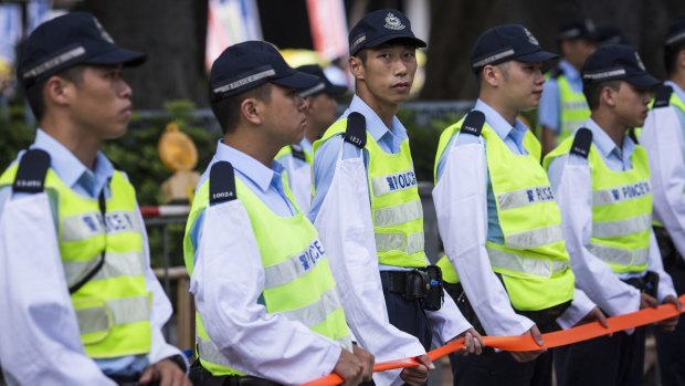 Police officers stand guard during a pro-democracy rally in Hong Kong, China, on Sunday.