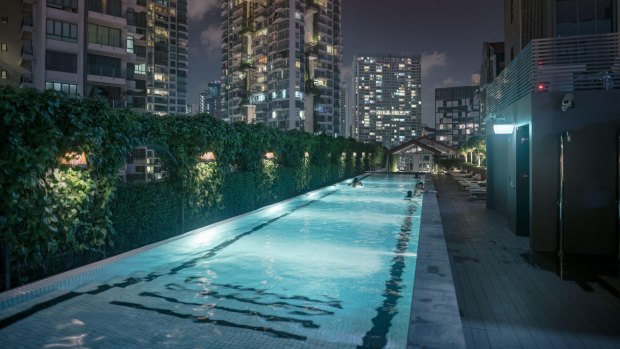 The pool is on an open-air deck above the Singapore River.