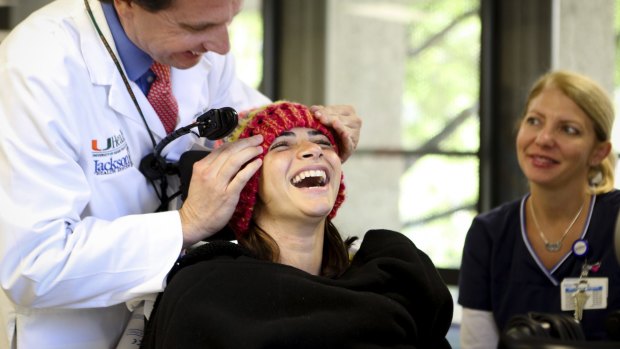 Dr. Antonio Marttos treats Lais Souza at Jackson Memorial Hospital in Miami, April 22, 2014. 