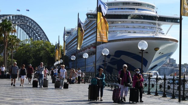 Cruise ship passengers disembark from Ruby Princess at Circular Quay, Sydney, last Thursday.