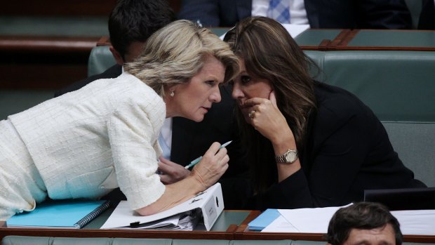Foreign Minister Julie Bishop speaks with Prime Minister Tony Abbott's chief-of-staff Peta Credlin.