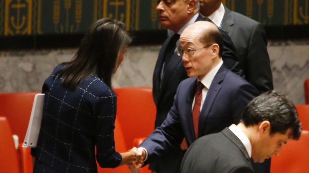 US Ambassador to the US Nikki Haley speaks to China's Ambassador Liu Jieyi after a vote to adopt a new sanctions resolution against North Korea on Monday evening.
