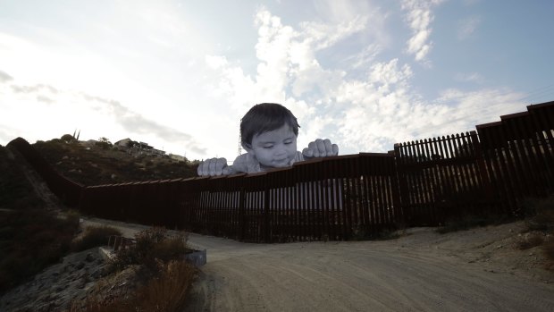 The Mexican boy artwork by French artist JR in Tecate, Mexico, on the Californian border, aims to prompt discussions about immigration.