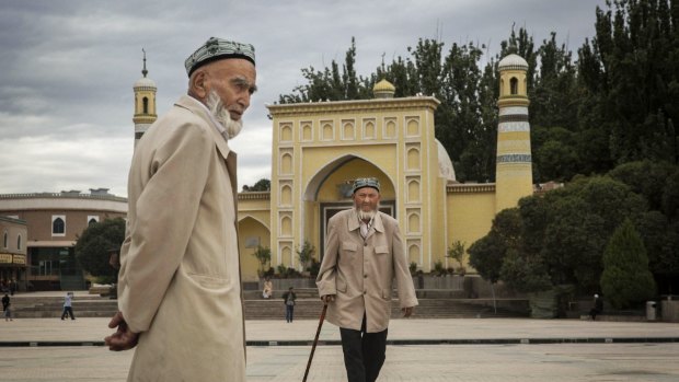 Uighur men in front of the Id Kah Mosque, Kashgar, Xinjiang, last year. 