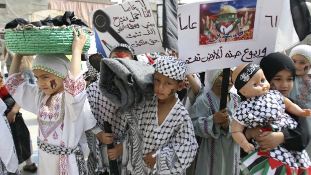 Palestinian children re-enact the Nakba  in the Palestinian refugee camp of Ain al-Hilweh in Lebanon in 2009.