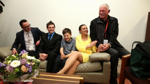 Independent senator Jacqui Lambie's son Dylan Milverton (second from left) was with family members at Parliament after Senator Lambie gave her first speech to the Senate last year.