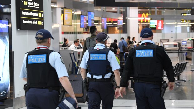 Increased airport security and queues at Melbourne Airport in light of the Sydney terror plot.