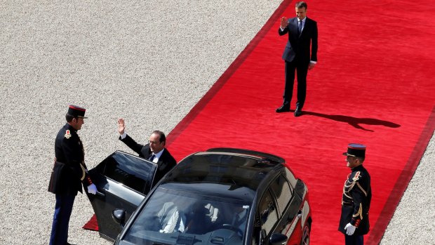 Outgoing French President Francois Hollande, centre, waves as he leaves the Elysee Palace on Sunday after handing the country over to Emmanuel Macron, top.